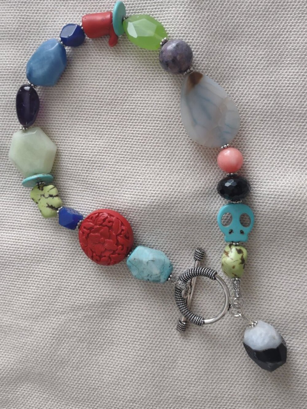 Vintage handmade necklace - multicolor agate, skulls, sterling silver toggle